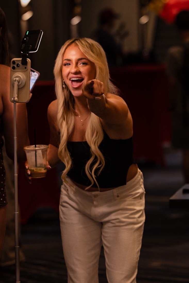 An RL creator on camera at an RL event